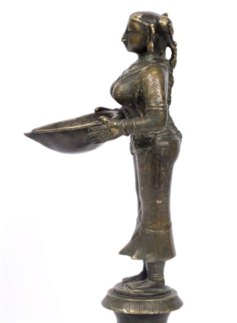 An Indian Bronze Lakshmi Figure Th Century The Goddess Holding A