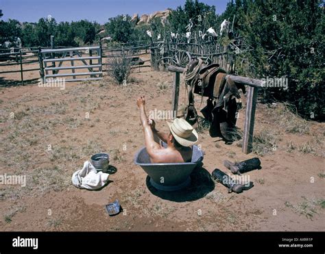 A Cowboy And Historian Marc Simmons Takes A Bath In A Metal Bathtub On