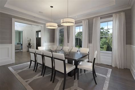 The Formal Dining Room With Paneling And Tray Ceiling Is Serviced By A