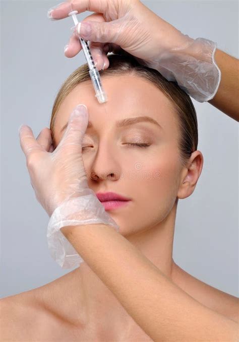 Woman Is Getting Botox Injection Anti Aging Treatment And Face Stock