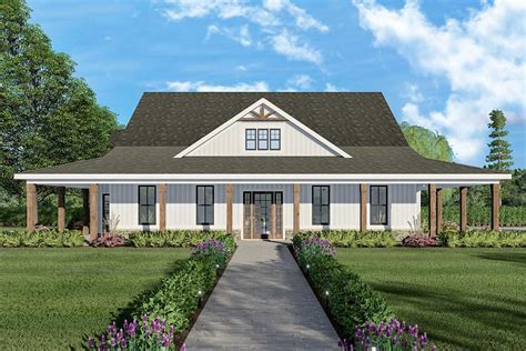 The Symmetrical Exterior Of This Ranch Home Plan Exclusive To
