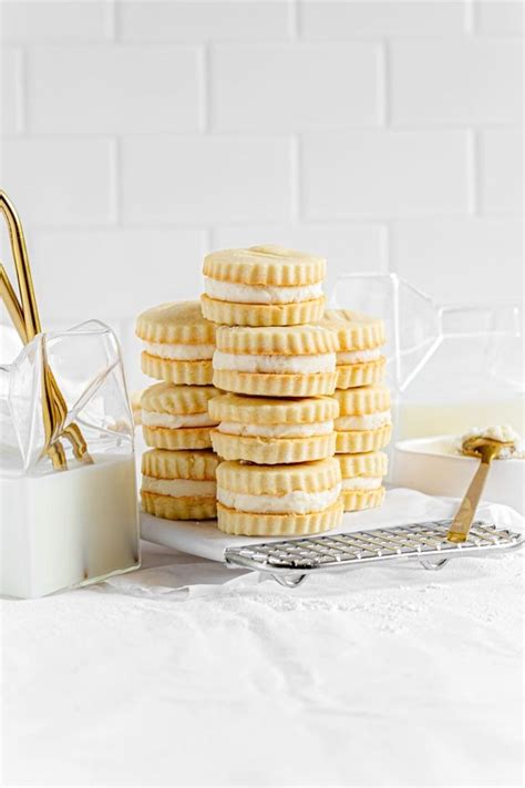A Stack Of Cookies Sitting On Top Of A White Table