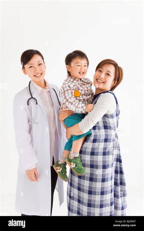 Pregnant Mother And Son With Doctor Stock Photo Alamy