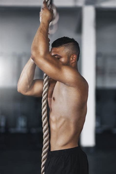 Rope Climbing Is All About Upper Body Strength A Young Man Climbing A