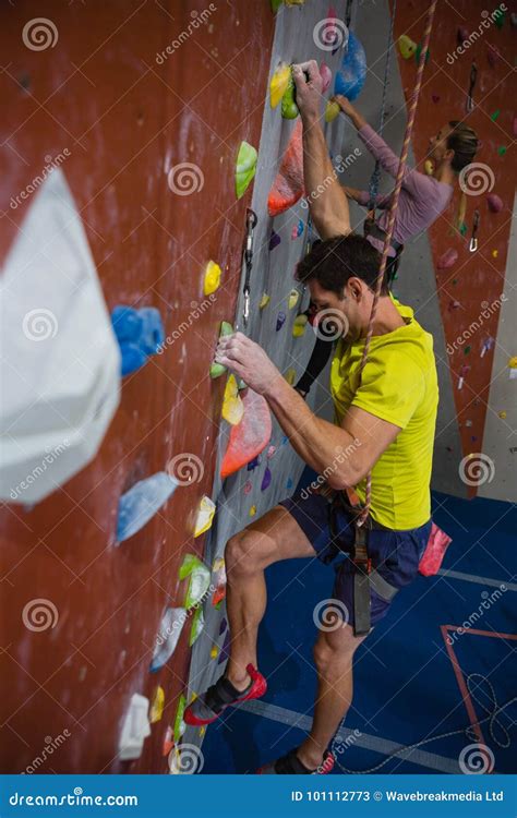 Side View Of Athletes Rock Climbing In Fitness Club Stock Image Image
