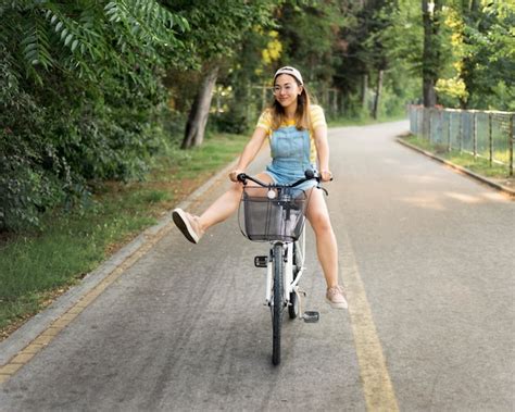 Free Photo Beautiful Young Girl Riding Bike Outdoors