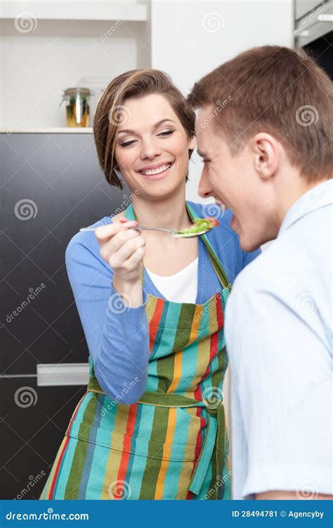 woman offers her husband to taste salad stock image image of hair