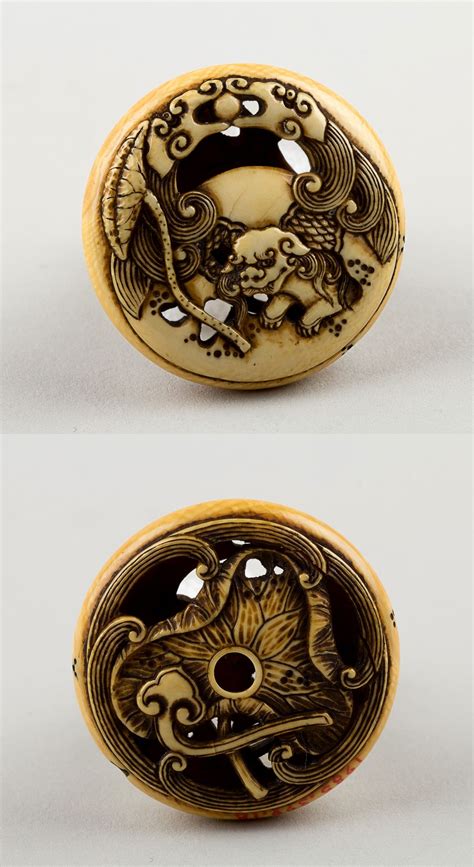 netsuke carved with shishi reverse with lotus leaf attributed to rensai ivory stone carving