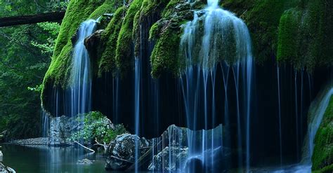 Time Lapse Photo Of Waterfalls In Mossy Rock Formation · Free Stock Photo