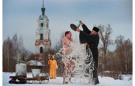 Russians Plunge Into Icy Water To Mark Epiphany