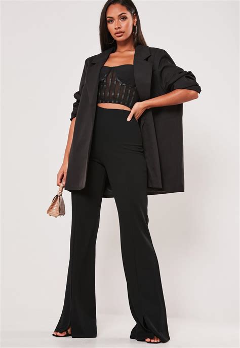 Open front split may not be as pretty as a squared front split or a side split, but it sure gets work done. Petite Black Split Hem Wide Leg Pants | Missguided