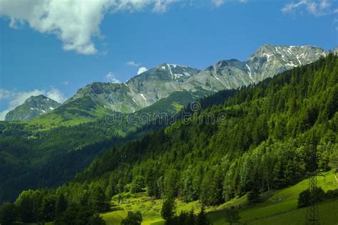Background Landscape View Of The Snowy Peaks Of The Alps And The