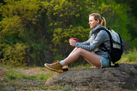 Young Woman Traveler Hiking In Summer Forest And Stopped To Have
