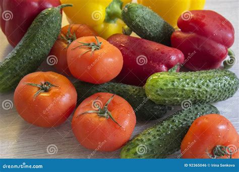 Delicious And Colorful Peppers Cucumbers And Tomatoes Lying On Stock