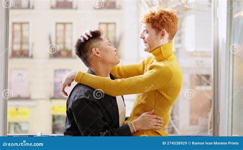Romantic Scene Of A Gay Couple At The Balcony At Home Stock Image