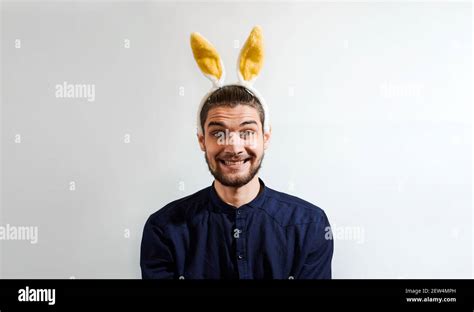 Charming Young Man With Beard In Shirt Wearing Easter Bunny Costume