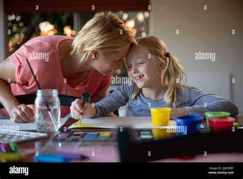Mother And Daughter Painting Together Stock Photo Alamy