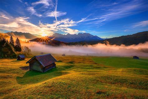 Nature Sunset Houses Sun Rays Mountains Sky Clouds Forest