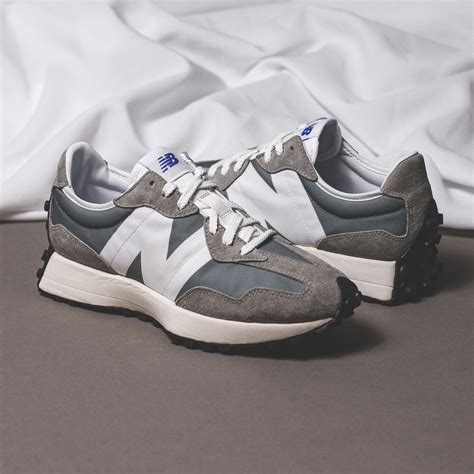 As for men, customers can choose between a vibrant half blue and orange iteration, or a neutral grey and white pair. New Balance 327 - MS327LAB / WS327CPA - Solestop.com