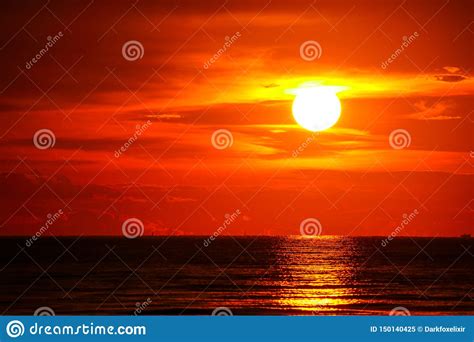 Sunset On Sea And Ocean Last Light Red Sky Silhouette Cloud Stock Image