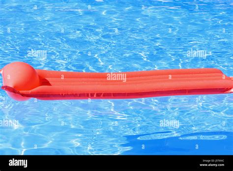 Airbed In Swimming Pool Stock Photo Alamy