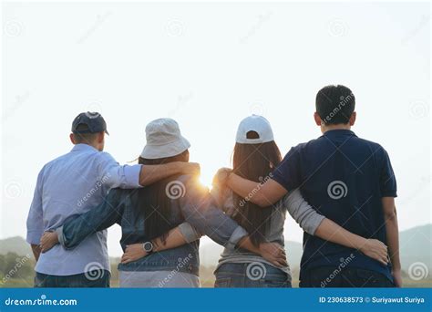 Closeup Of Male And Female Friends Hugging Each Other Looking At The