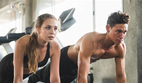 Couple Love Young Fitness Man And Women Workout Exercise Together Weight Training And Cardio