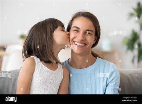 Mother Kissing Daughter On Cheek Hi Res Stock Photography And Images