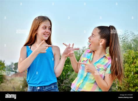 Best Friends Forever Two 12 Year Old Teenage Girls Looking At Each