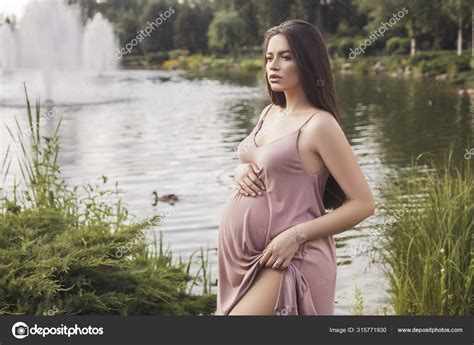 Sexy Brunette Pregnant Woman In Park Summer Day Sunset Stock Photo By