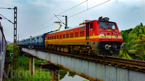 12625 is a popular trivandrum cntl to new delhi mail express train and covers a distance of about 3040 km. The Parasuram Express on a Girder Bridge in a Wet and ...