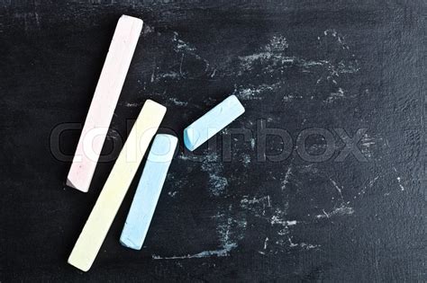 Four Pieces Of Chalk Over A Blackboard Stock Image Colourbox