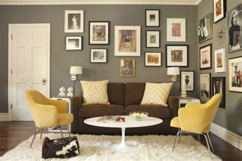 The misty haze on the walls tones down the room so that you can easily focus on the beautiful piece of furniture. Brown, grey & mustard living room | Brown living room, Yellow living room, Living room grey