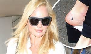Margot Robbie Reveals Subtle Anchor Tattoo On Her Left Foot As She Jets