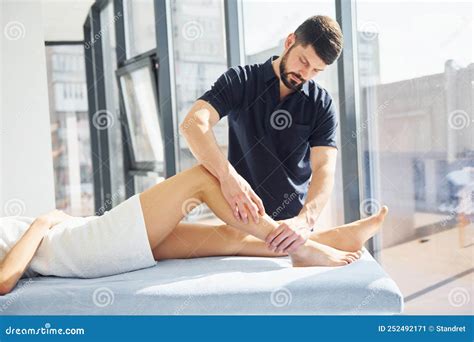 Guy Does Legs Massage Young Woman Is Lying Down When Man Serves Her At Spa Stock Image Image