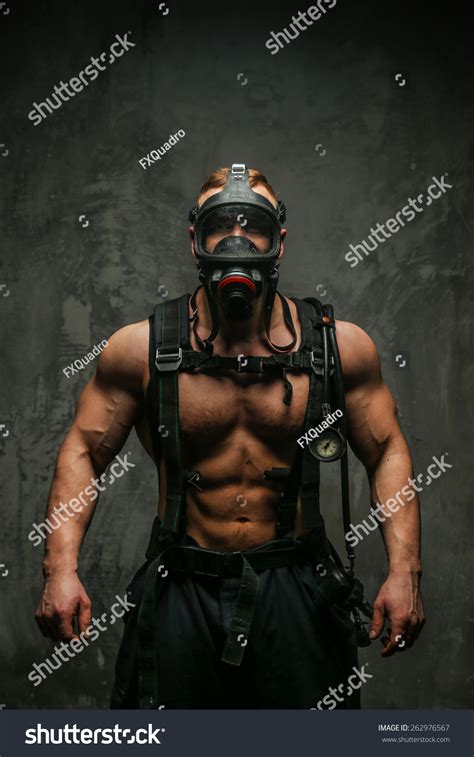 Muscular Firefighter In Oxygen Mask With Naked Torso On Grey Background Stock Photo