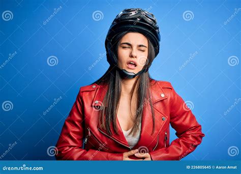Young Beautiful Brunette Motorcycliste Woman Wearing Motorcycle Helmet And Jacket With Hand On