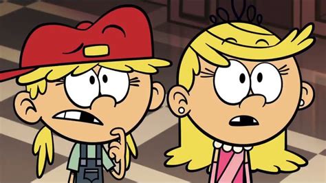 Two Cartoon Characters One With Blonde Hair And The Other Wearing A Red Hat Are Facing Each Other