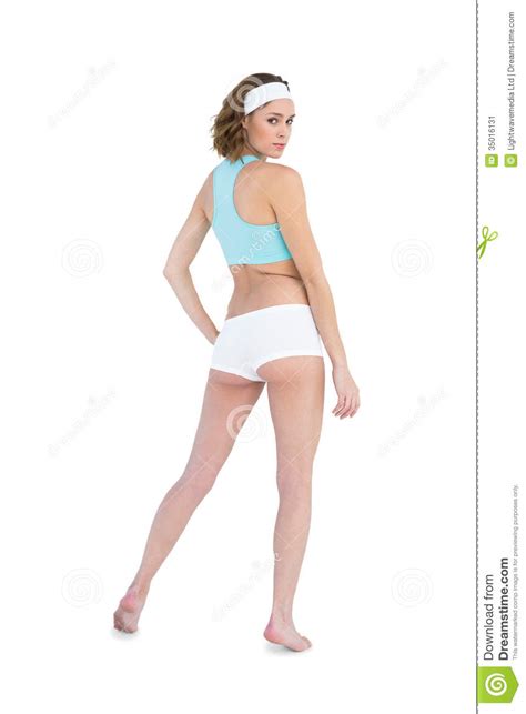 Serious Slender Woman Wearing Sportswear Posing With Hand On Hips Stock