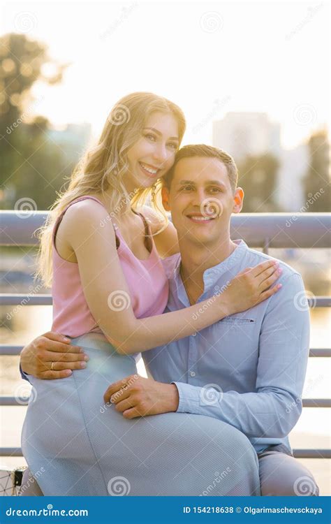 Beautiful Girl Sitting In A Guy S Lap Hugging Him Stock Photo Image Of Fashion Nature