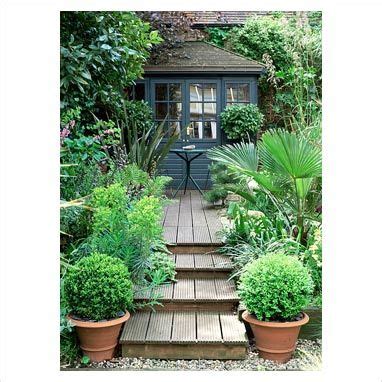 Gap had developed between the stringers and the frame on an older deck i was examining. GAP Photos - Garden & Plant Picture Library - Decking steps leading to painted summerhouse ...