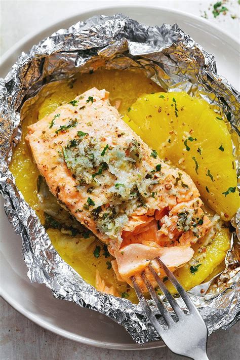 Fold the sides of the foil over the salmon to cover and completely seal the packet closed so the butter does not leak. Garlic Lemon Butter Salmon in Foil with Pineapple — Eatwell101