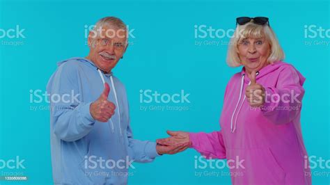 Grandmother Grandfather Showing Thumbs Up Pointing Empty Place