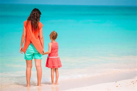 Premium Photo Beautiful Mother And Daughter At Caribbean Beach Enjoying Summer Vacation