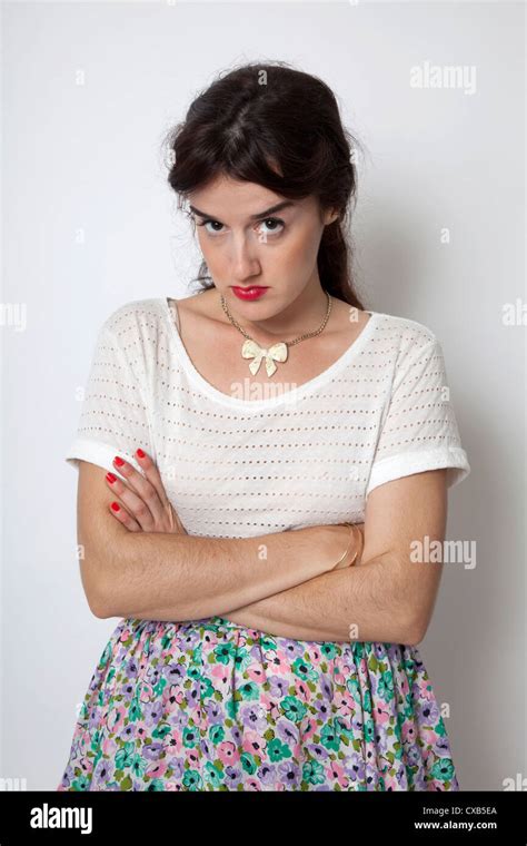 Annoyed Angry Woman In Floral Skirt Studio Shot Stock Photo Alamy