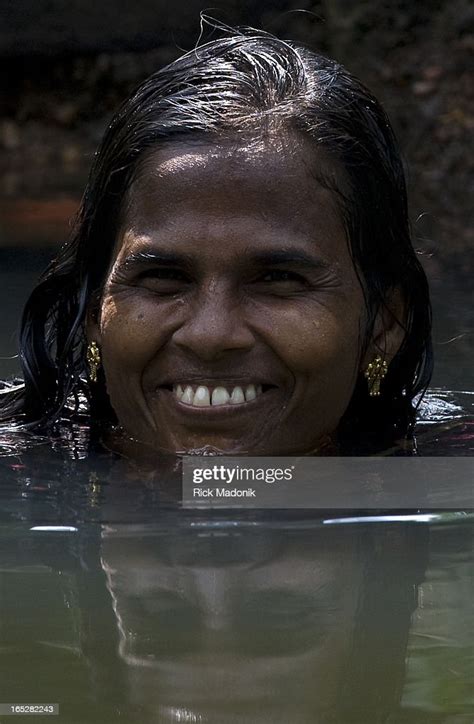 Kerala India A Woman Bathes In A Canal In Front Of Her House News Photo Getty Images