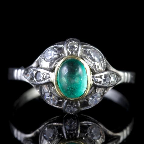 Refining designs to their basic geometric essence, resulting in a clean and linear design language that became associated with the period. Antique Art Deco Emerald Diamond Platinum Ring Circa 1920 ...