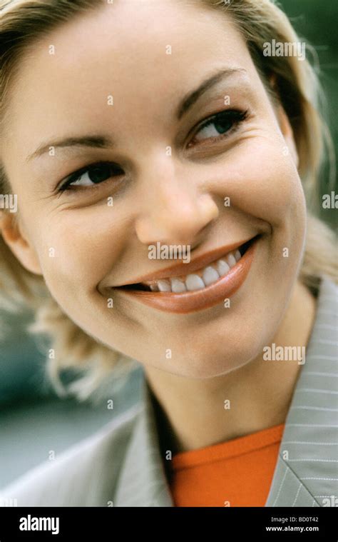 Portrait Smiling Blond Woman Looking Sideways Hi Res Stock Photography