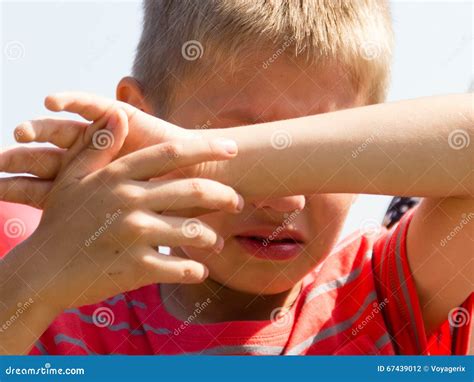 Little Young Boy Kid Covering Eyes From Sunlight Stock Photo Image