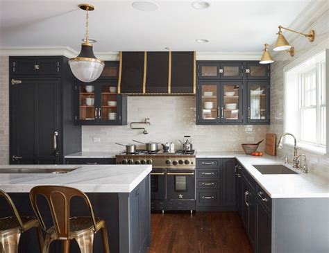 Matte black hardware accents white shaker cabinetry, white farmhouse, and quartz stone backsplash. 6 Hardware Styles to Pair With Deep-Blue Shaker Cabinets